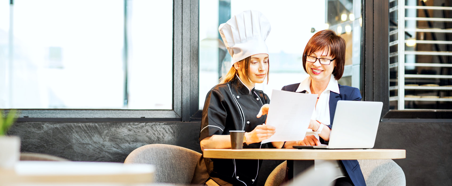 chef discussing with businesswoman
