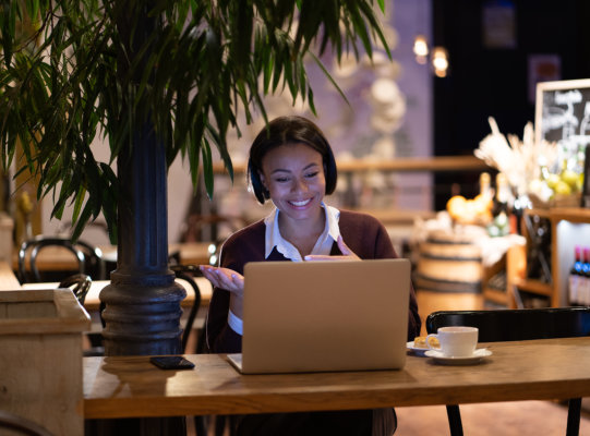 woman smiling using laptop
