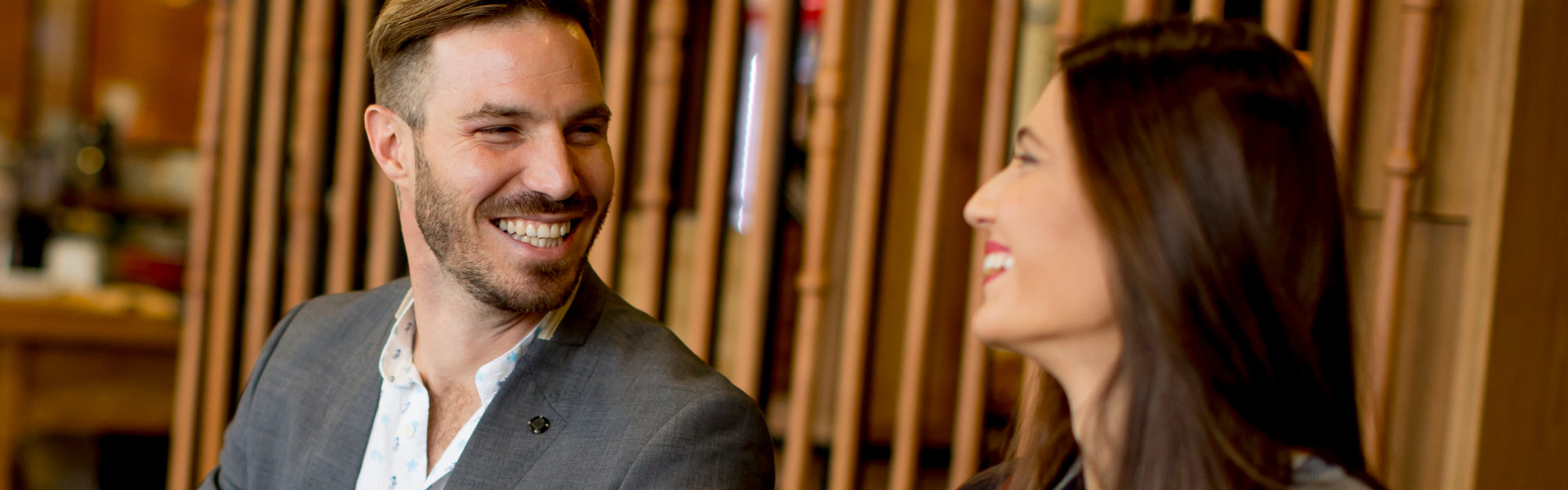 man smiling with woman