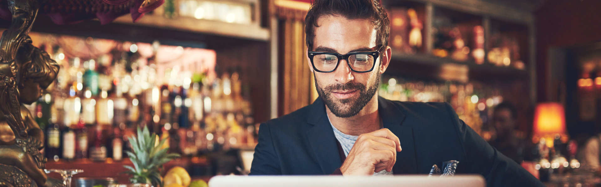 man smiling using laptop